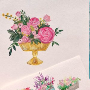 Pink flowers in gold urn