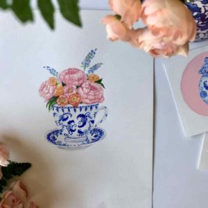 flowers in blue tea cup